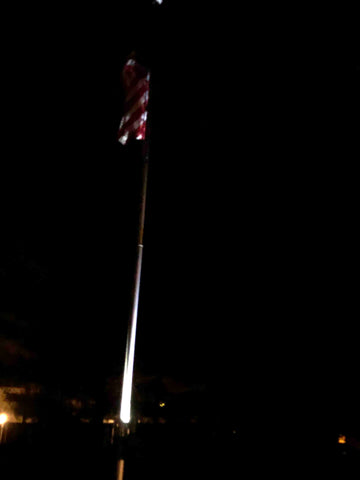 Flagpole at night with solar flagpole light