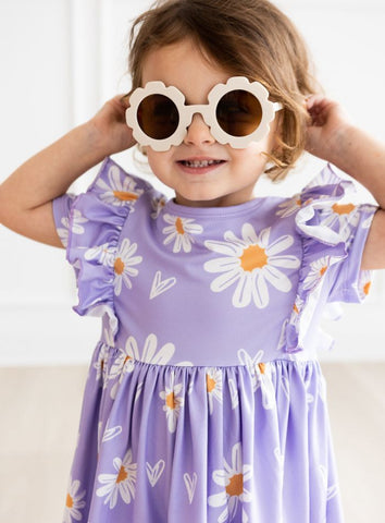 little girl in I heart daisies ruffle twirl dress