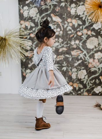 scattered dot twirl dress under gray pinafore