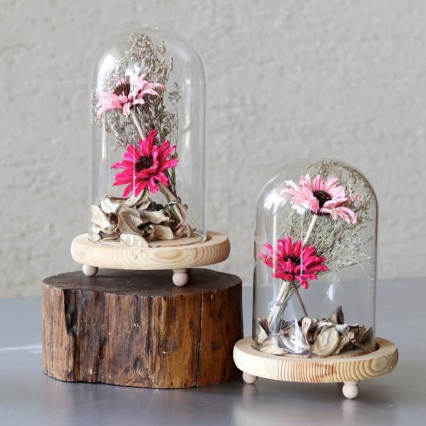 dried flowers inside glass dome showpiece