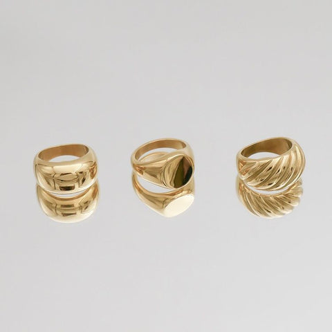 Different types of women's signet rings and band rings