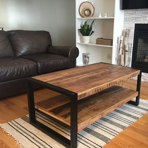 Rectangular coffee table with industrial flare paired with leather sofa