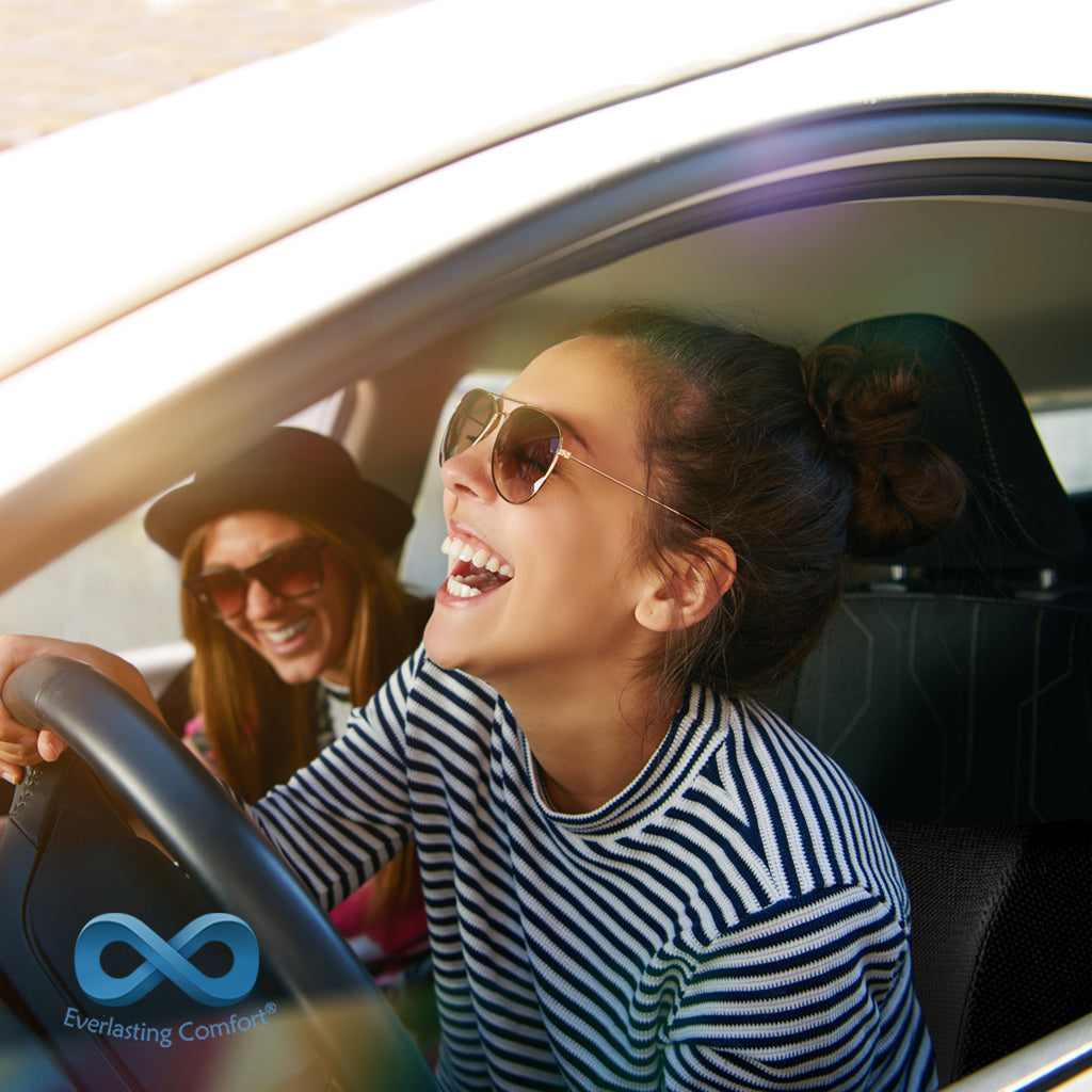 girl laughing at the wheel