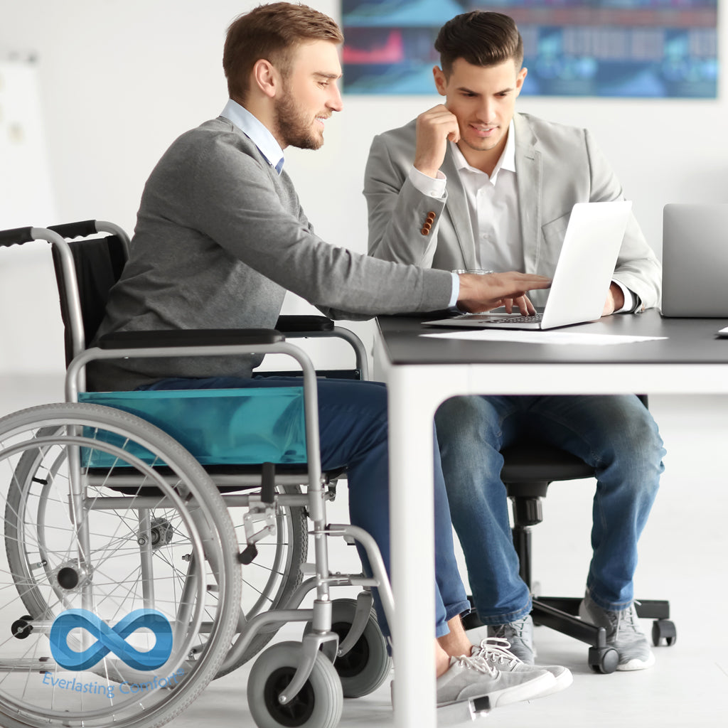 man in a wheelchair working in the office