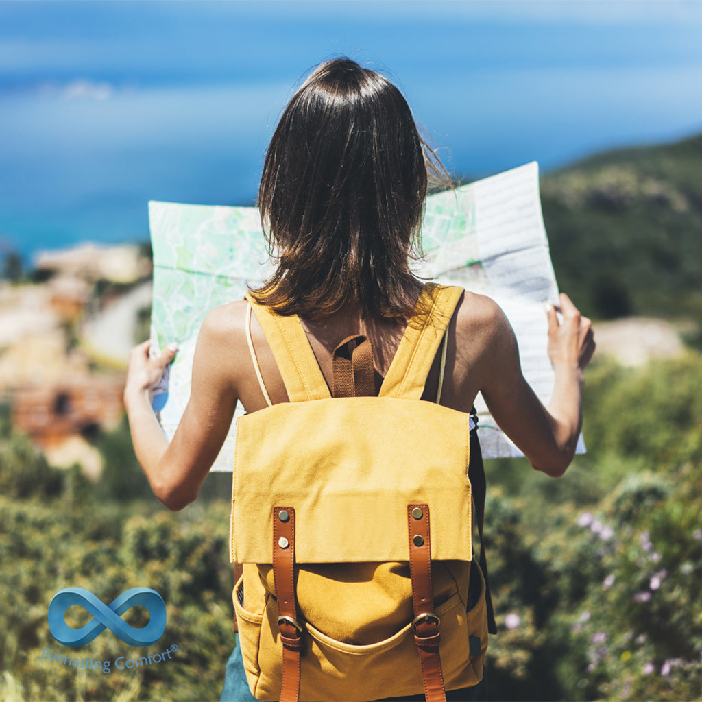 travel girl with backpack and map