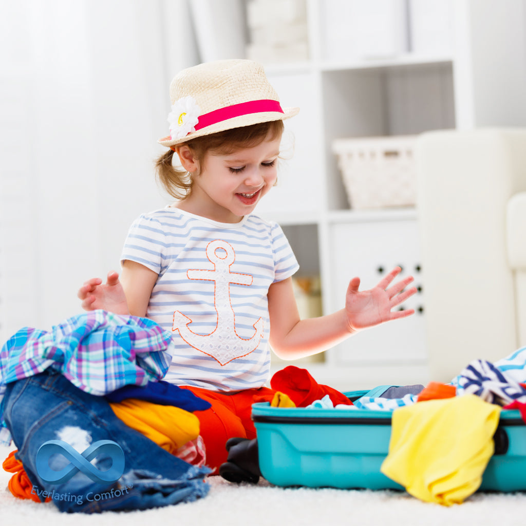 little girl packing suitcases