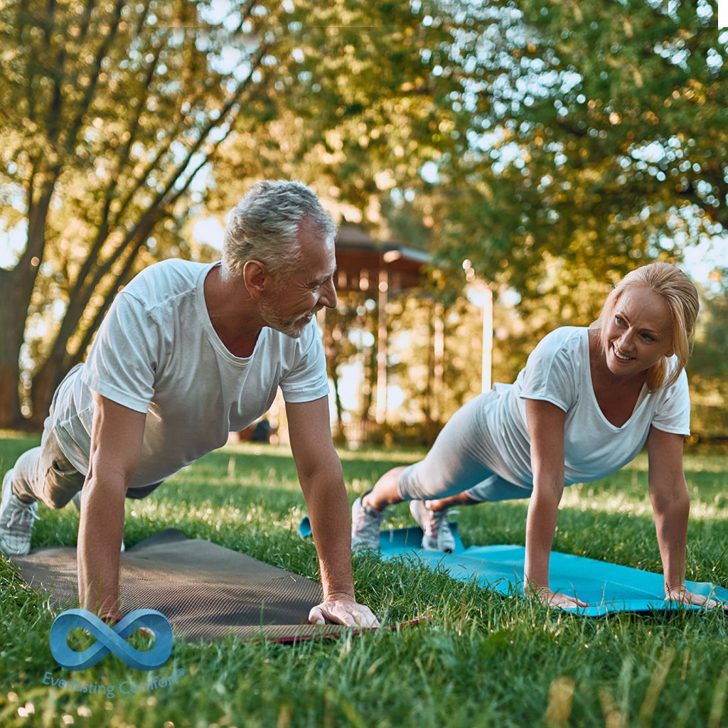 adult couple doing sports on the grass