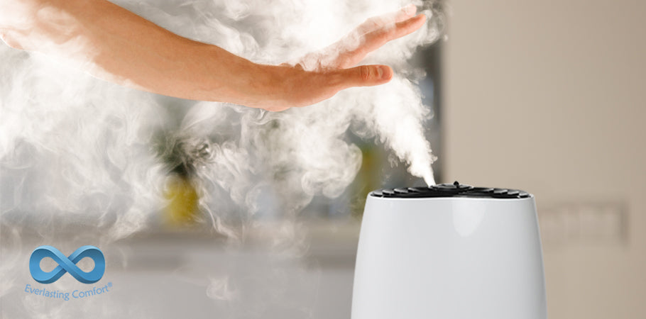 hand covers steam from humidifier