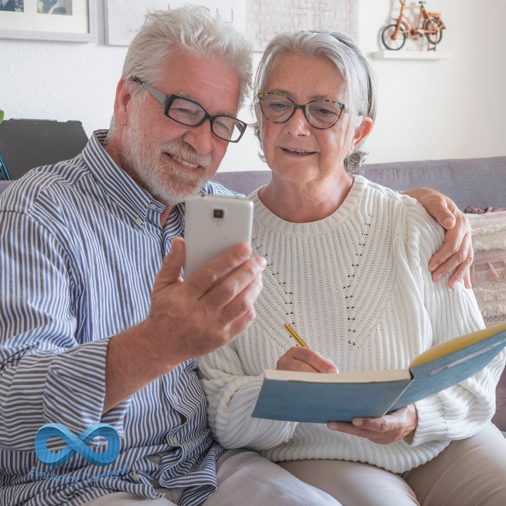 elderly couple looking at the phone