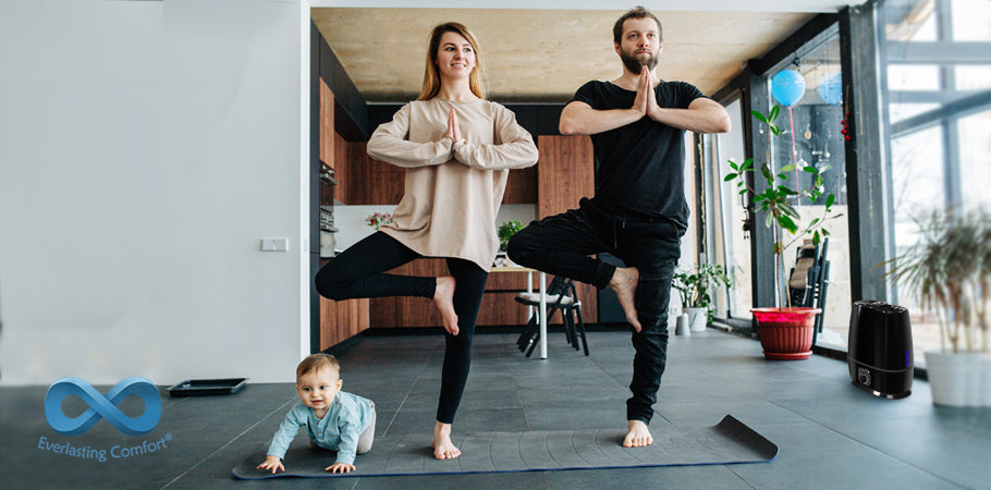 family doing yoga on the mat
