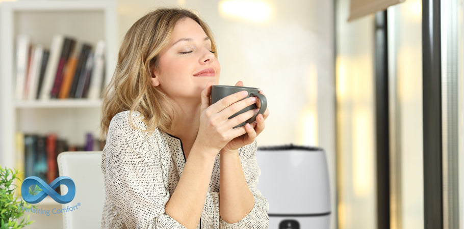 girl with closed eyes holds a mug in her hands