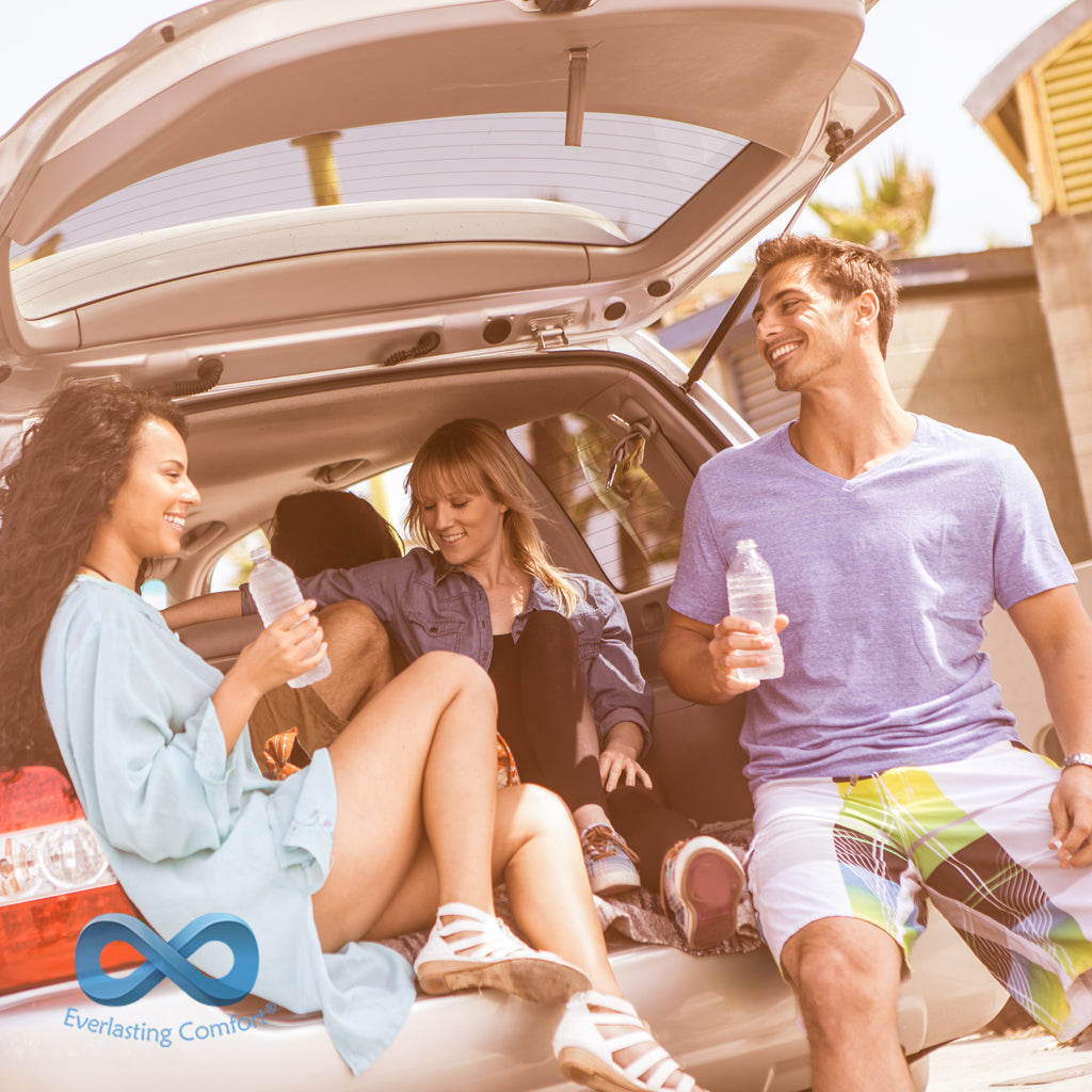 friends having fun in the trunk of a car