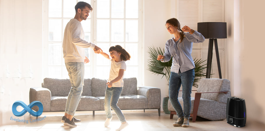 family dancing in a bright room