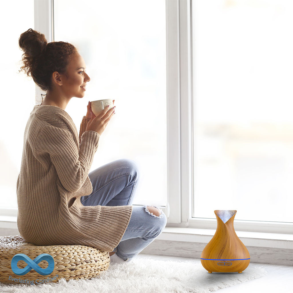 the girl drinks coffee and looks out the window