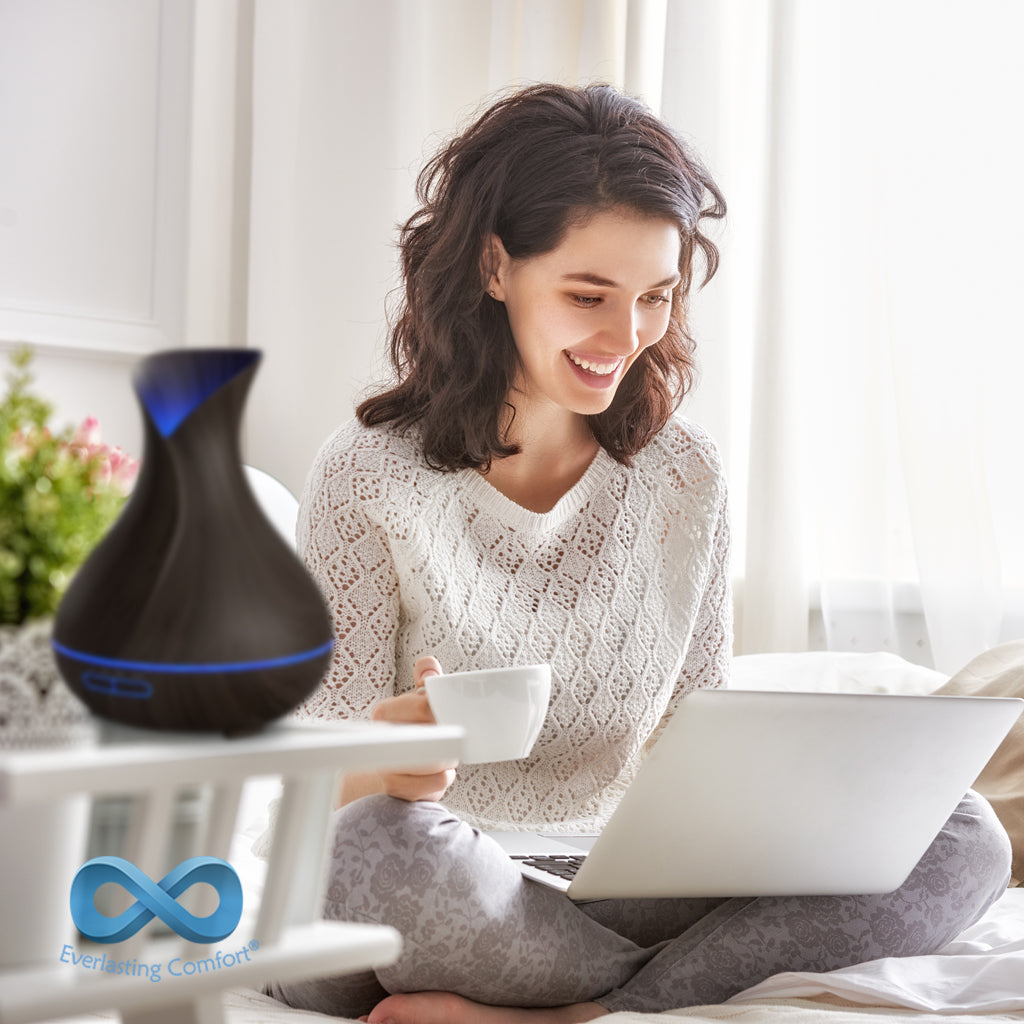 girl working at the computer on the bed