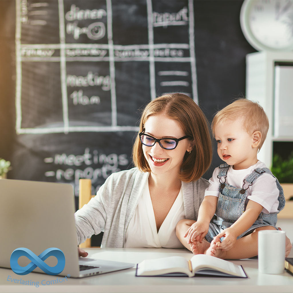 woman with a child working at home at the computer