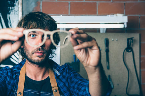 Worker holding a handcrafted wooden frame