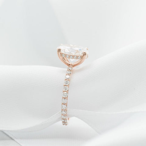 custom oval diamond engagement ring with pave and a hidden diamond halo 14k rose gold