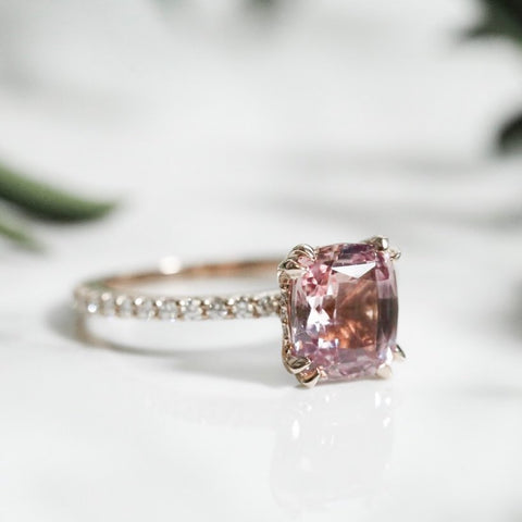 colored gemstone custom engagement ring in rose gold with diamonds on the band