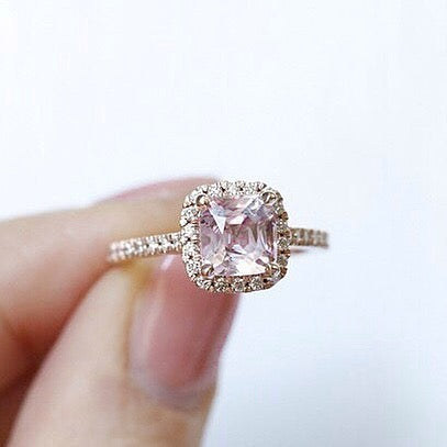 pink spinel gemstone custom engagement ring with a diamond halo and diamonds on the band set in rose gold