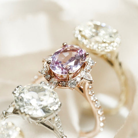 gemstone custom engagement ring with intricate diamond halo