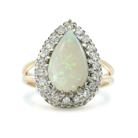 Estate pear shaped opal ring with a matching diamond halo and 14k white and yellow gold mixed split shank band