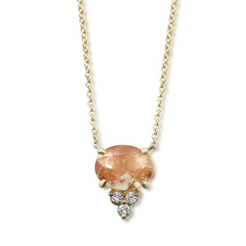 Sunstone gemstone prong set necklace with white diamond cluster and 14k yellow gold chain