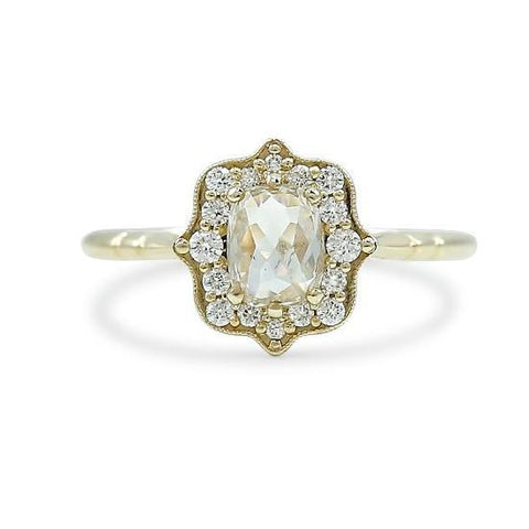 rose cut white diamond engagement ring with a unique diamond halo and yellow gold band