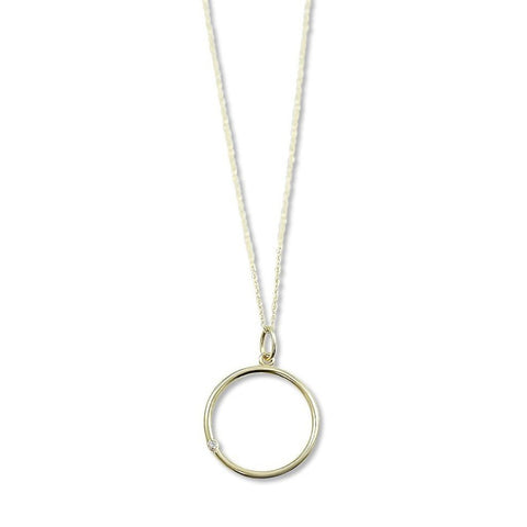 14k yellow gold necklace with circle pendant and a dainty bezel set diamond