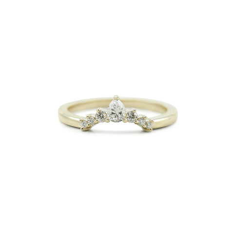 diamond and yellow gold contour wedding band with pear shaped diamond and round diamonds 