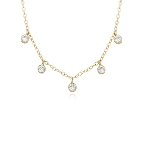 bezel set diamond layering necklace with a yellow gold chain