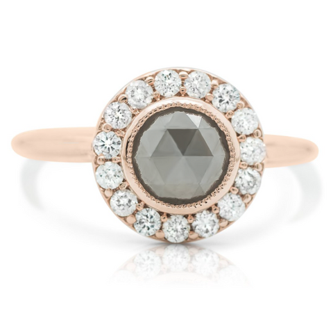 round gray diamond ring with rose gold band and white diamond halo