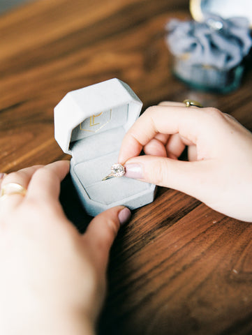 custom white diamond round solitaire engagement ring with a yellow gold band