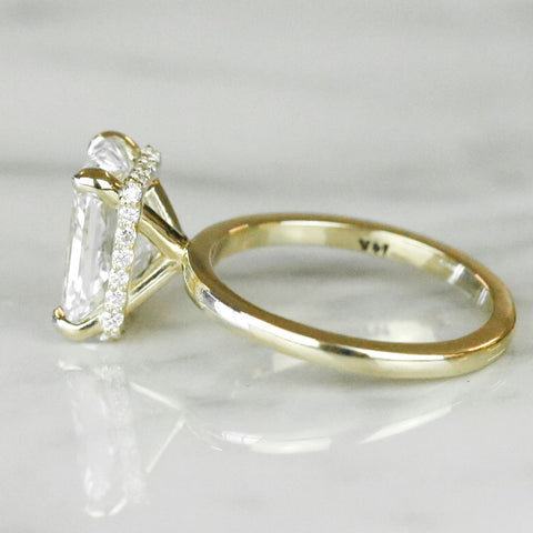 radiant cut diamond engagement ring with a hidden halo