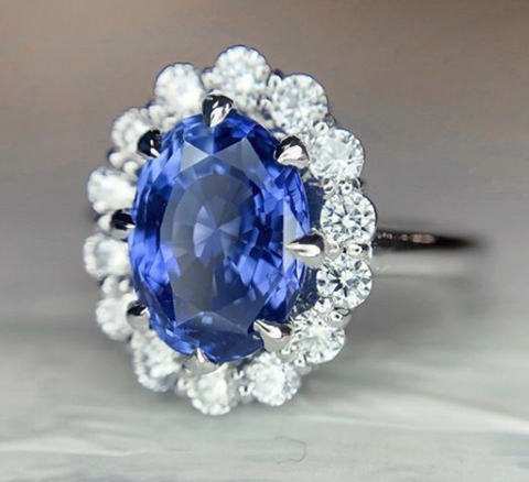 Custom sapphire engagement ring with a delicate halo