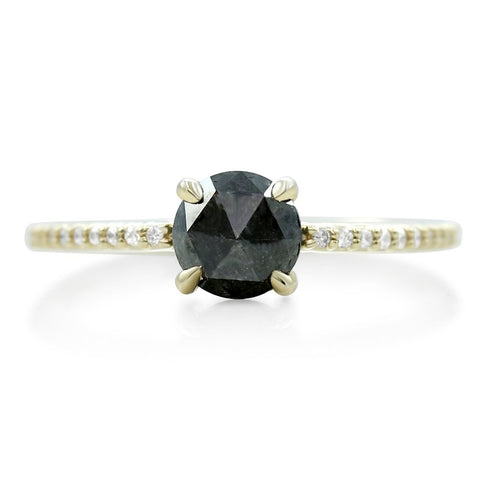 rose cut black diamond ring with white diamonds and a thin yellow gold band