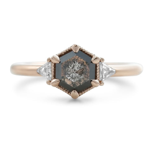 geometric inspired dark gray hexagon shaped diamond and white diamond engagement ring with six prong setting in 14k rose gold