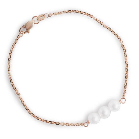 three pearl bracelet with a yellow gold chain