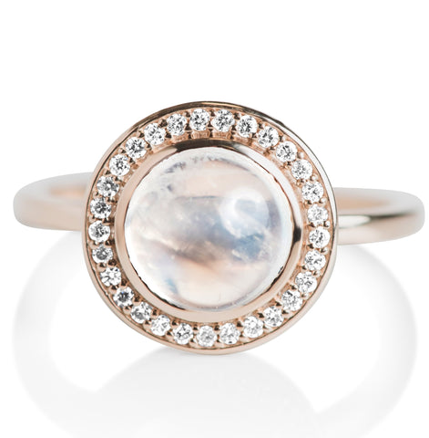 Moonstone cabochon right hand stack ring with a thin yellow gold band and a diamond halo