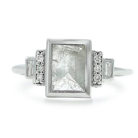 gray diamond ring with round and baguette side stones and a white gold band