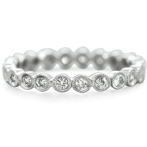 white gold estate eternity band with bezel set and milgrain white diamonds all the way around. 