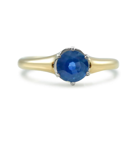 antique round prong set sapphire engagement ring with mixed metals white gold and yellow gold