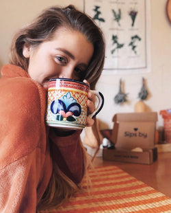 woman holding a mug of tea