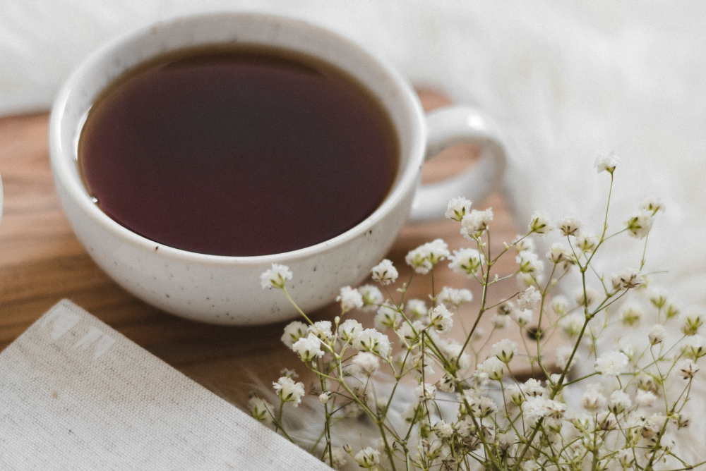 Cup of sore throat tea in stoneware tea mug