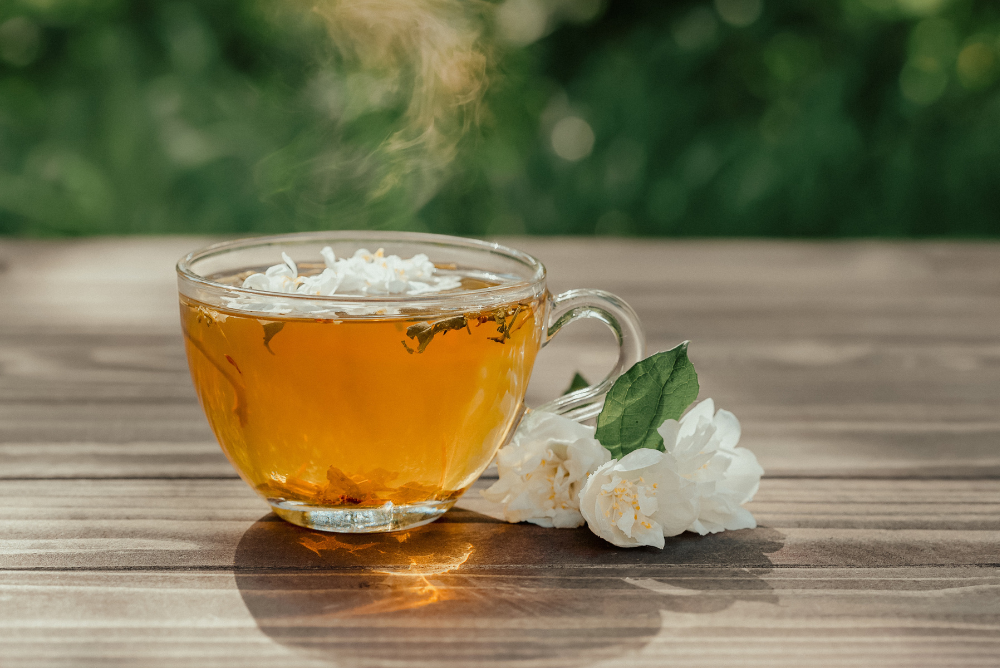 Glass mug with jasmine green tea