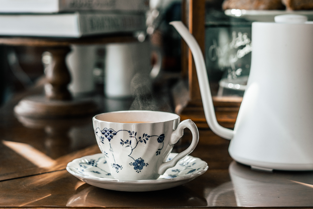Blue and white teacup with white kettle