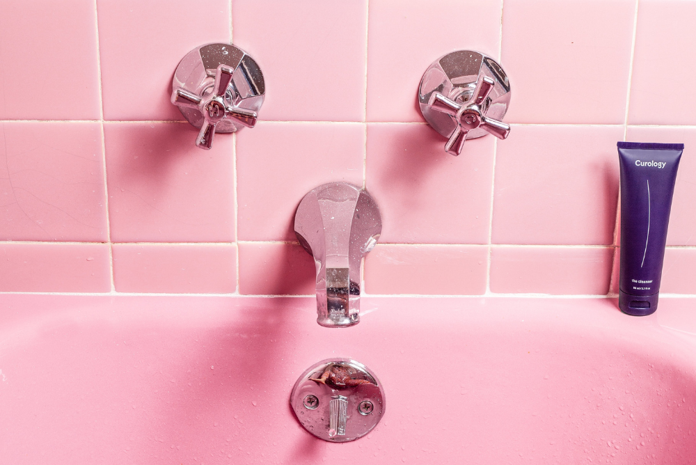 Pink bathtub with pink tile