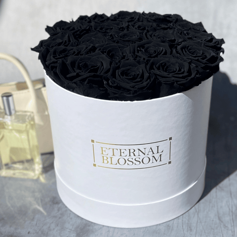 large round arrangement of black eternal roses