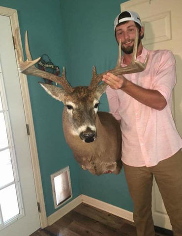 Devin Knight Holding his Mounted Buck
