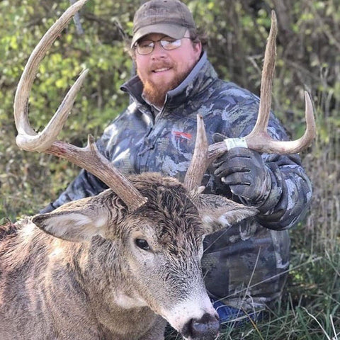 The Photo of Him and his Buck